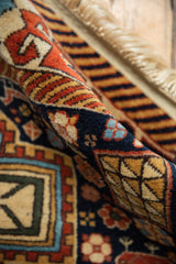 Even hand-knotted pile and original side selvage on a vintage Romanian geometric rug.