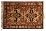 Vintage Romanian Kazak rug with double starburst medallions in rust, navy blue, and ivory tones.