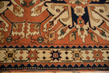 Interconnected starburst and diamond motifs on the border of a vintage Romanian Kazak rug.