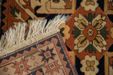 Corner detail of a vintage Kazak rug showing its woven back, intact selvage, and clean ivory fringe.
