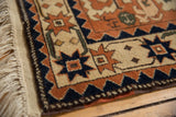 Intact side cord, clean fringe, and geometric starburst border on a vintage Romanian rug.