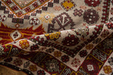 Plush hand-knotted pile of a vintage Shirvan rug showing rust, gold, and mauve rams horn motifs.