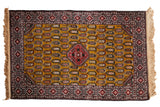 Vintage Romanian Shirvan design rug with a stepped red medallion and boteh rows on a brilliant gold field.