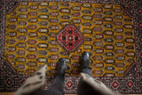 Full pile and detailed boteh pattern on the rich gold ground of a vintage Romanian Shirvan rug.