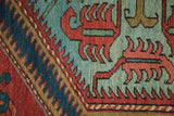 Well-preserved pile of a hand-knotted antique Serapi with bold red and powder blue motifs.