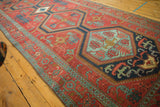 A long view showing the paneled column of medallions on a late 19th-century Persian Serapi runner.