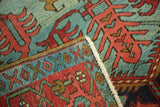 Hand-knotted pile texture and original side cord selvage on a collector's antique Persian Serapi rug.