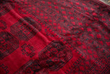 Plush, full wool pile showing the charcoal gul medallions on a cherry red vintage Ersari rug.