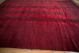 View across the like-new, full pile of a vintage Afghani Ersari carpet in cherry red.