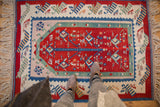 Intact side selvage, fringe, and geometric patterns on a Vintage Turkish Kilim rug corner.