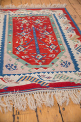Fully secured ivory fringe and colorful pictorial border of the hand woven Kilim.