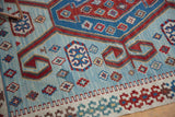 Angled detail of a vintage Turkish Kilim showing its flat weave and geometric motifs.