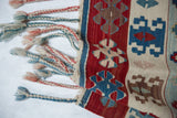 Original side cord selvage and multicolored braided fringe on a vintage Turkish Kilim.