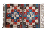 Hand woven Turkish Kilim rug, natural ivory, red, blue geometric paneled finned design.