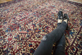 Dense, interconnected pattern with red and blue palmettes on a vintage Mehrivan carpet.