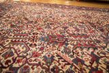 Detailed view of the interconnected palmettes and full pile of a vintage Mehrivan rug.