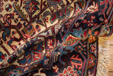 Draped folds of a vintage Mehrivan rug reveal its full, plush pile and traditional vinery.