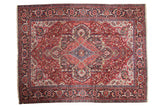 Vintage Ahar carpet with an ornate diamond medallion on a red field with delicate floral vinery and navy borders.