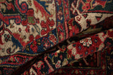 A gentle fold in the vintage Ahar carpet reveals its deep, plush hand-knotted pile.