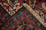A vintage Ahar carpet's folded corner reveals its plush pile, hand-knotted back, and tidy fringe.