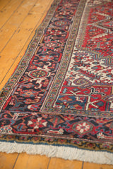 Corner of a vintage Heriz carpet highlighting the geometric borders, even pile, and original selvage.