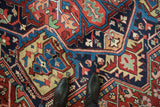 Phenomenal wool pile of an antique Bakshaish collector carpet showing geometric motifs in jewel tones.