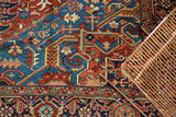 Detail of an antique Bakshaish carpet's plush wool, showing intricate palmettes and vinery in vivid gem tones.
