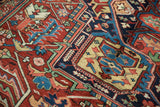 Crisp geometric palmettes and stylized vinery in rich jewel tones on a Persian Bakshaish carpet.