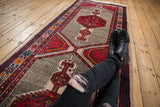 Mid-20th century Serab runner with cherry red geometric medallions and striated finned ground.