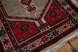 Geometric motifs and finned ground on vintage Serab runner with cherry red, beige, and fringe.