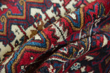 Original side cord selvage and full, plush wool pile of a vintage Mehrivan carpet.