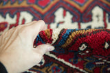 The thick, plush, and even wool pile of a hand-knotted vintage Mehrivan carpet.