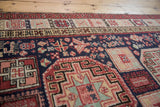 Close view of the vintage Ardebil runner's full pile and detailed geometric patterns.