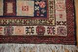 Plush hand-knotted pile and geometric borders on a vintage Ardebil runner's corner with intact ivory fringe.