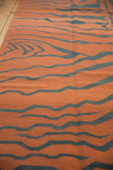 Hand-woven tiger stripes with abrashes in pale rust and dusty teal charcoal.