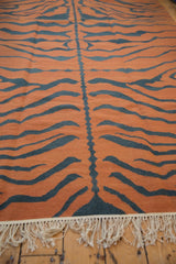Vintage hand woven kilim with pale rust and dusty teal charcoal tiger stripes, cream fringe.