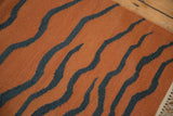 Pale rust and dusty teal tiger stripe pattern on vintage Indian Kilim, fringe.