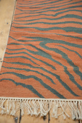 Vintage Tiger Kilim with rust and dusty teal stripes, subtle abrashes, and cream fringe.