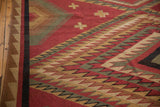Intact side cord selvage and sharp geometric brick red, beige, green Soumac pattern.
