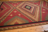 Vintage Indian Soumac carpet's geometric border and original side cord selvage.