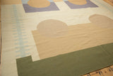 Corner of vintage contemporary Kilim rug with olive green, sand, pale blue abstract pattern.