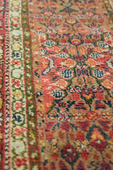 Antique Serab runner's reciprocating Laleh Abbasi pawn motif border with playful, alternating colors.