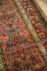 Varied pile texture and intricate floral motifs of a late 19th-century Persian Serab rug.