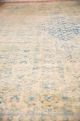A close view of the distressed rug's even wear, revealing the knot heads and foundation.