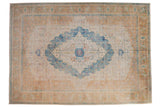 Softly colored distressed Bulgarian carpet with a bold Herati medallion in blue, ivory, and terracotta.