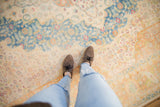 A personal view of the soft, distressed pile of a vintage Bulgarian Herati design rug.