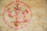 Vintage Peking carpet: intricate five-clawed dragon with terra cotta, blush, and blue eyes.