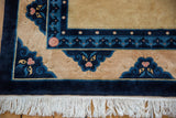 Peking carpet corner with multi-dragon faced border, blush accents, and ivory fringe.