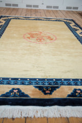 Hand knotted fringe, reciprocating pawn design, and multi-dragon faced main border.