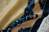 Peking carpet's plush pale gold pile, intricate cobalt blue border with pawn design, and fringe.